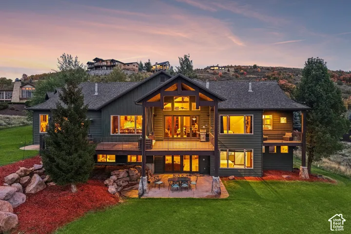 Multi-level exterior featuring dark siding and prominent gabled rooflines