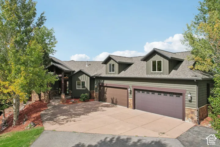 Craftsman-style exterior with wood siding and stone accents