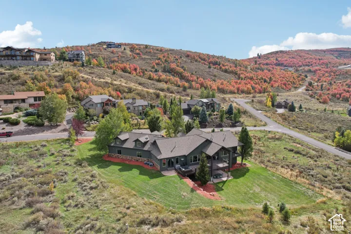 Expansive property featuring a multi-level exterior, an upper balcony, and a lower patio