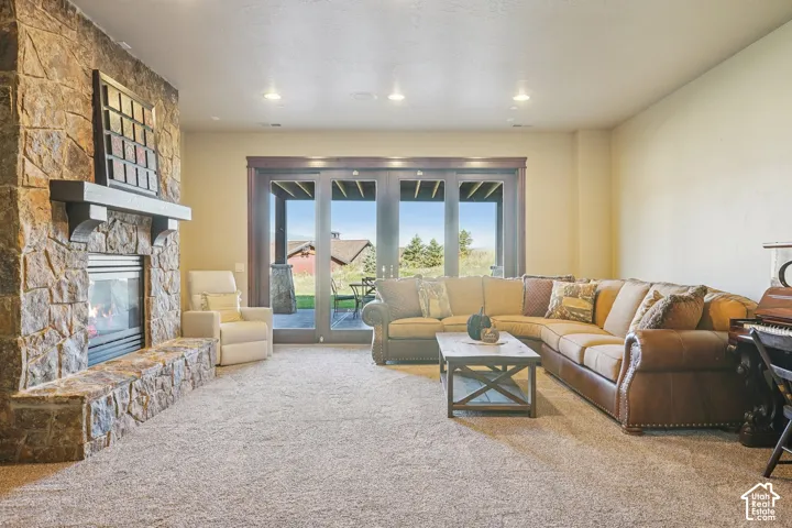 Stone-surround fireplace with a dark wood mantel
