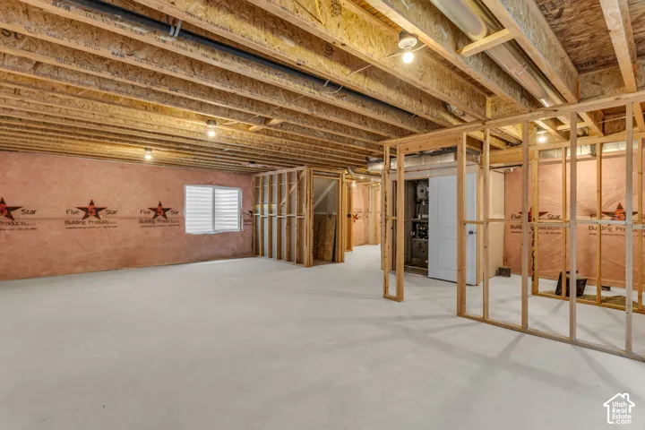 Unfinished basement with potential for large family/game room, full bathroom and one bedroom.