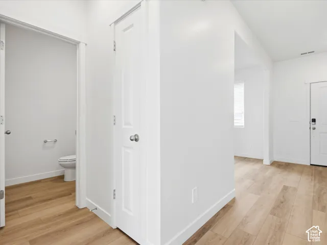 **DISCLAIMER** Interior package may vary. Wood-finish flooring, white panel doors, neutral wall palette, and white interior trim