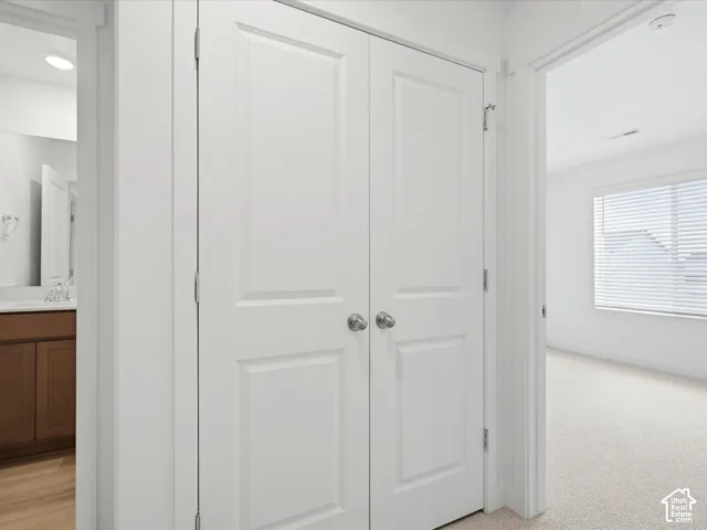 **DISCLAIMER** Interior package may vary. Double-panel interior doors with brushed nickel hardware, neutral carpeting, and a window with horizontal blinds