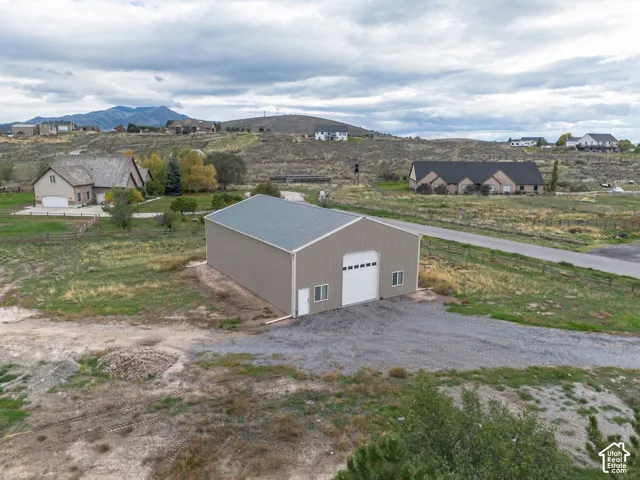2,500 SF Workshop. AI Used to remove cars from photo.