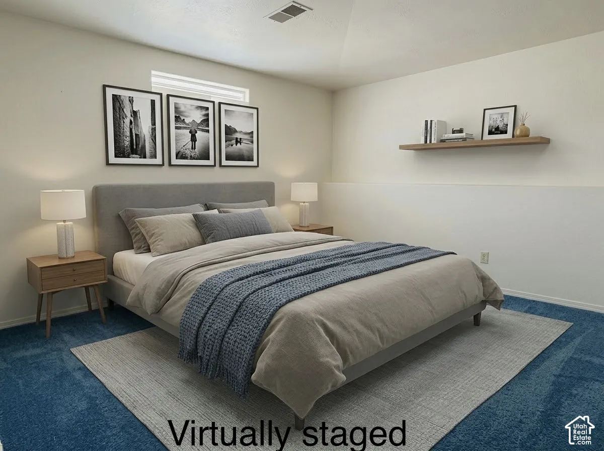 Neutral-toned room featuring blue carpeting, recessed lighting, and a wall-mounted floating wood shelf
