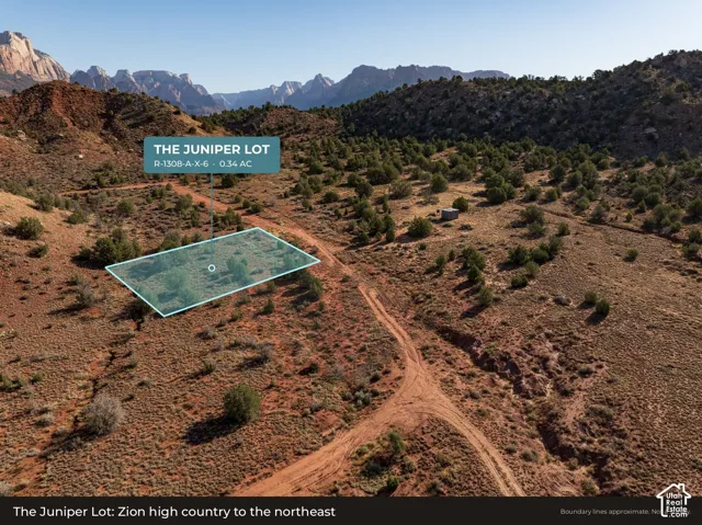 Aerial: The Juniper Lot (R-1308-A-X-6) with Zion National Park's high country on the horizon