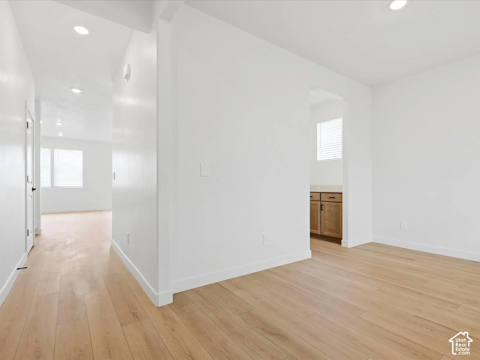 **DISCLAIMER**  Interior package may vary. Wood-finish flooring throughout, recessed lighting, and cabinetry with stone-surface countertops