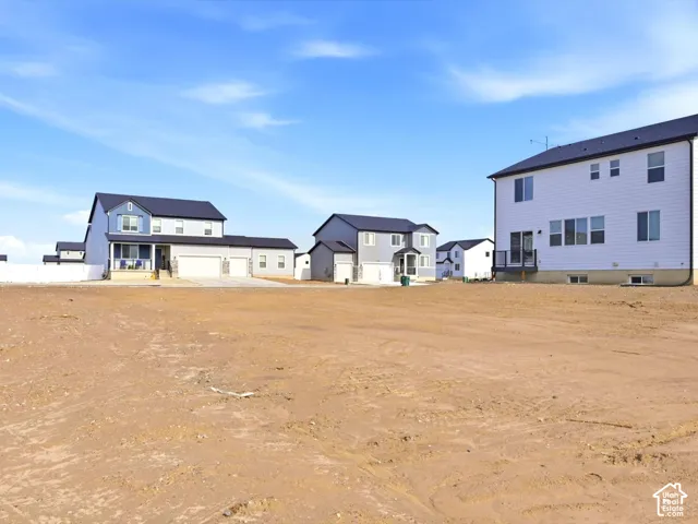 Expansive lot featuring open-space ground composition and residential surroundings