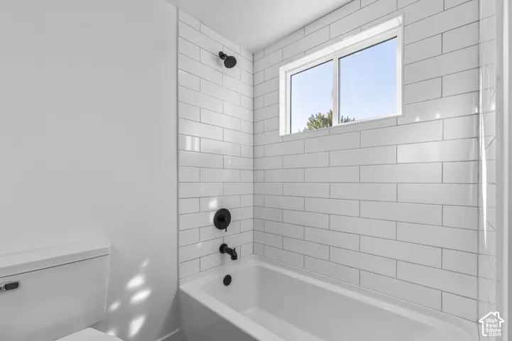 ALL NEW Deep Bathtub With Featuring Large Subway Tile Surround, And Matte Black Plumbing Fixtures