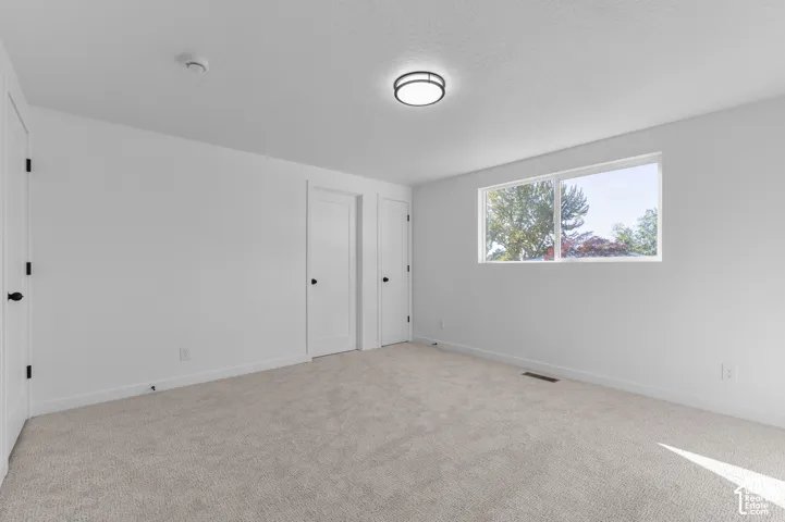 Primary Bedroom With Attached Primary Bathroom, NEW Carpet, Walk-In Closet And A 2nd Closet And Closet Organizers, And NEW Window