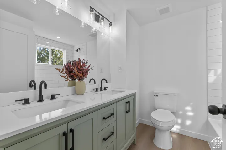 ALL NEW Attached Primary Bathroom With Dual-Sink Sage-Colored Vanity, Marble Countertop, Matte Black Fixtures, And Waterproof LVP Flooring