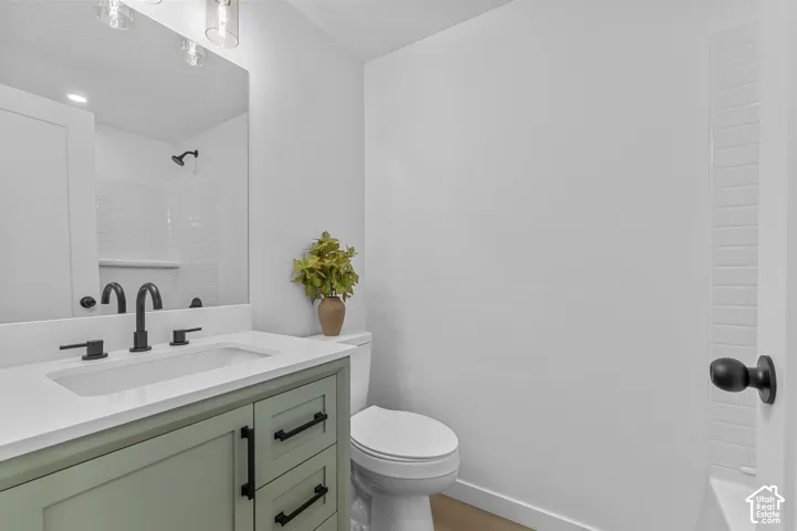 ALL NEW Bathroom With Sage-Colored Vanity With Matte Black Hardware, White Marble Countertop, Integrated Sink, Deep Soaking Tub, And LVP Waterproof Flooring