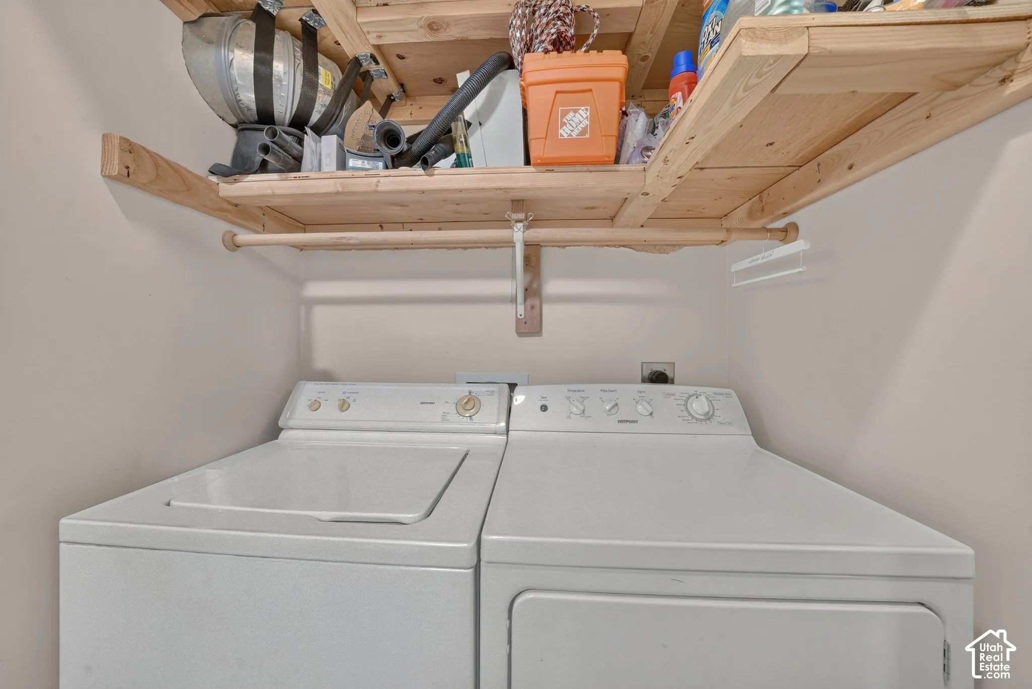 Laundry area with shelving; appliance inclusions require seller confirmation.