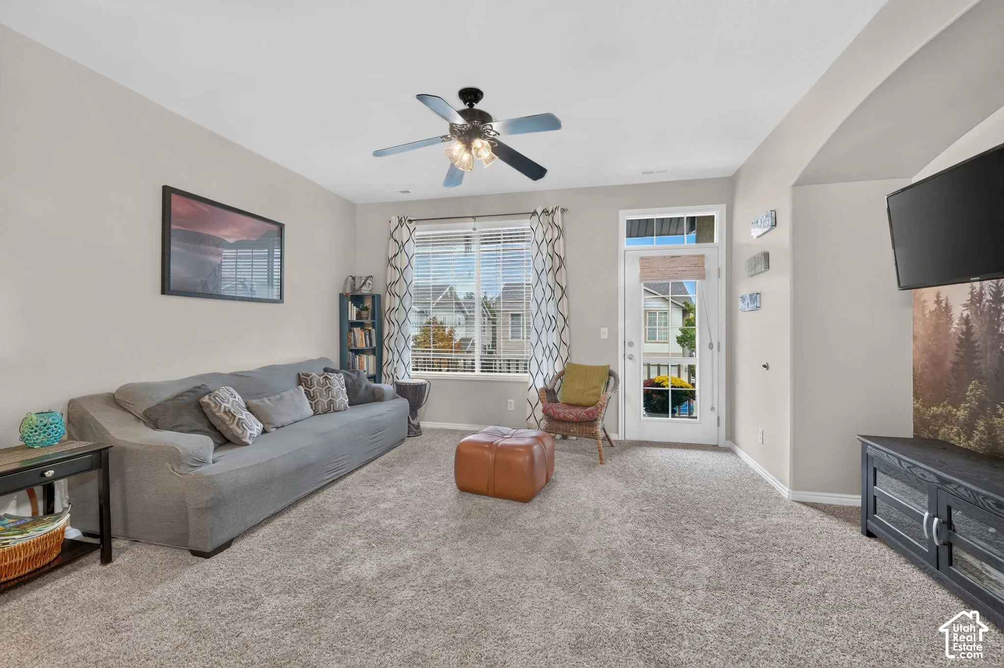 Living area with natural light and balcony access.