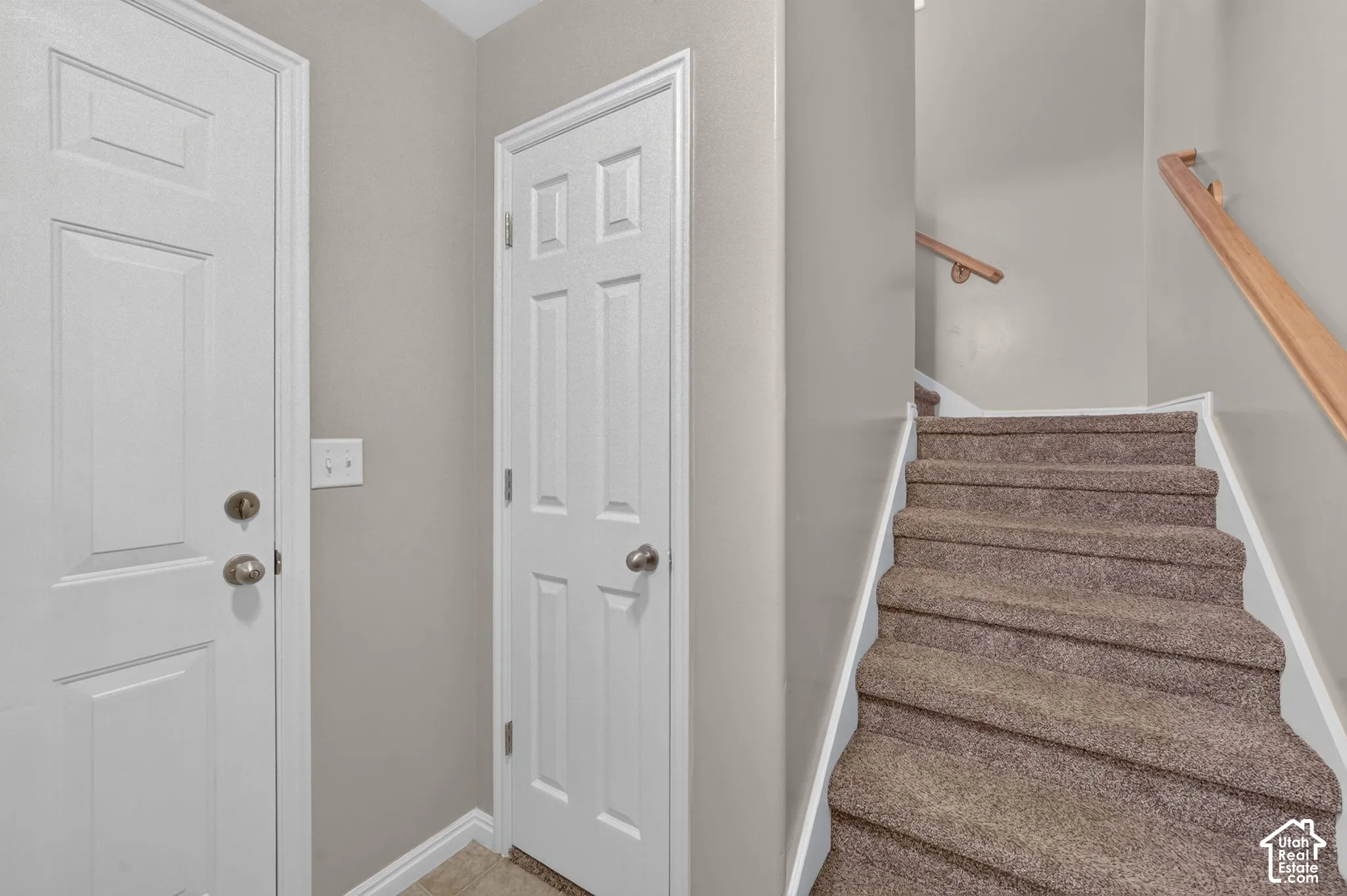 Ground-level foyer and stairs to the upstairs living spaces.