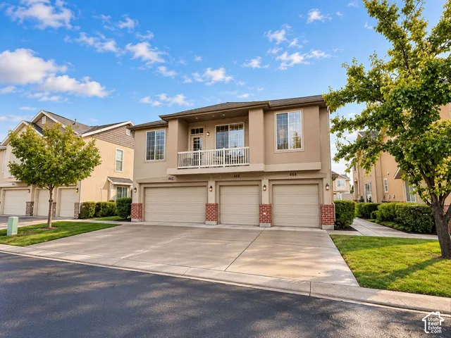 Building exterior; 468 includes one attached garage bay. Adjacent units and their garages are also visible.
