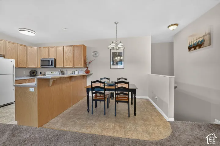 Dining space beside the kitchen breakfast bar.