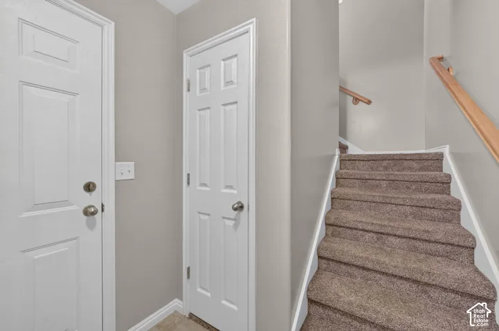 Ground-level foyer and stairs to the upstairs living spaces.