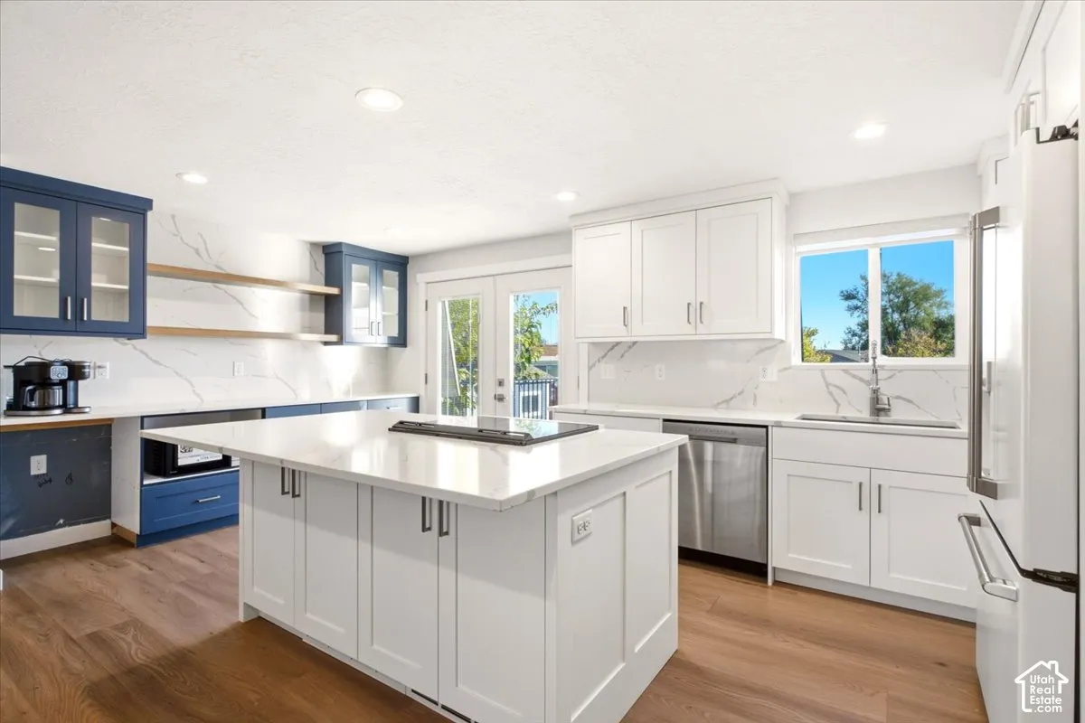 This is ONE beautifully layed out kitchen, lots of cabinets. GE Cafe Line of Appliance.
