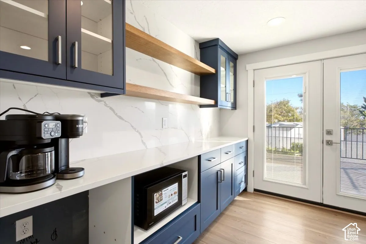 Wall long glass slow close cabinets & drawers. Quartz countertop