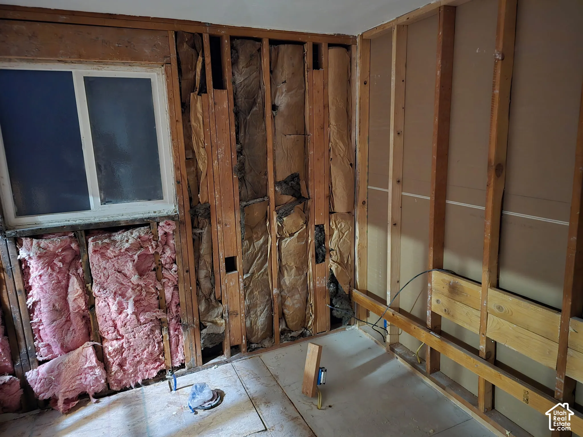 extensive remodel updates.  not a flip. updated electrical and plumbing upstairs. Exposed wood-stud wall framing with batt insulation and a single-pane sliding window