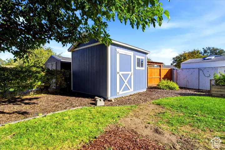 Tuff Shed near raised garden area.