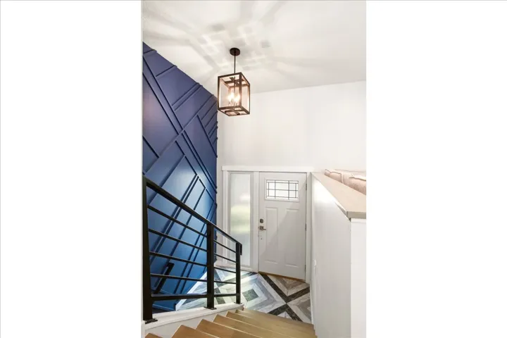 Geometric Accent wall at entry plus fabulous designed tile at entry. New front door.