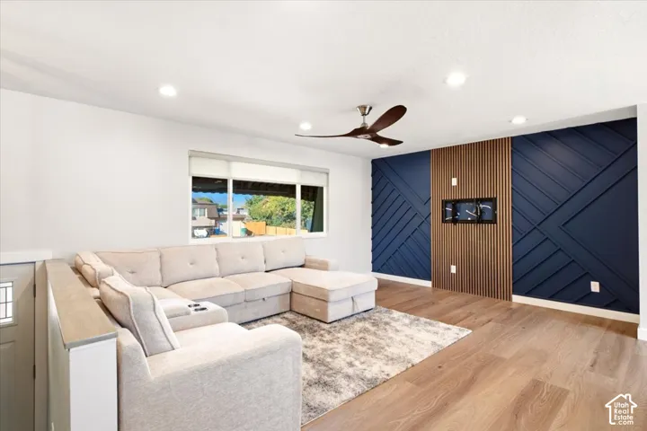 Geometric Accent Molding with TV mount, propeller ceiling fan, that match the 2 bedrooms upstairs.