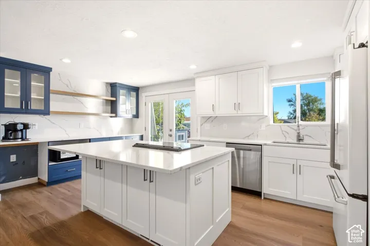 This is ONE beautifully layed out kitchen, lots of cabinets. GE Cafe Line of Appliance.