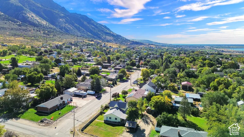 Aerial perspective featuring mountainous terrain and established residential landscaping