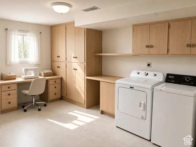 Custom-built light oak cabinetry featuring floor-to-ceiling storage, an integrated desk surface with multiple drawers, and overhead wall-mounted shelving