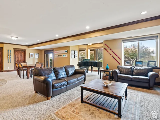 Expansive interior featuring recessed lighting, dark wood-finish trim, solid wood doors, and large windows with exterior surroundings