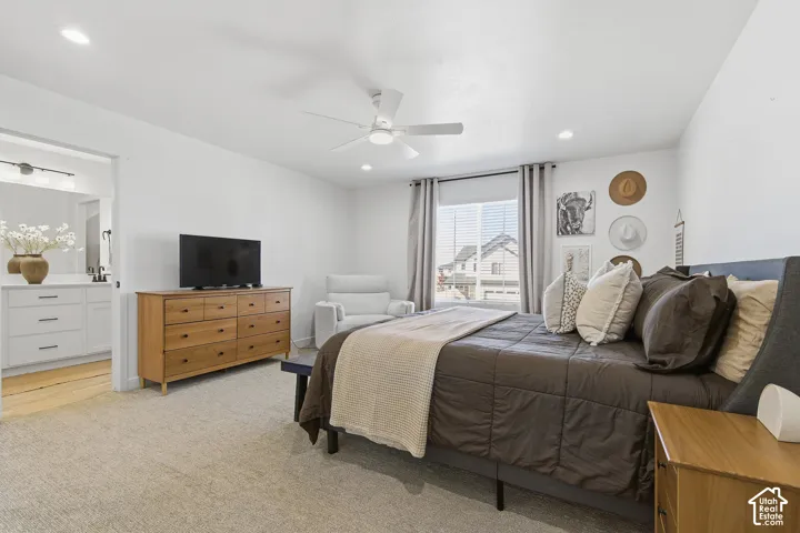 Neutral interior featuring carpeting, recessed lighting, a ceiling fan, and multi-pane windows