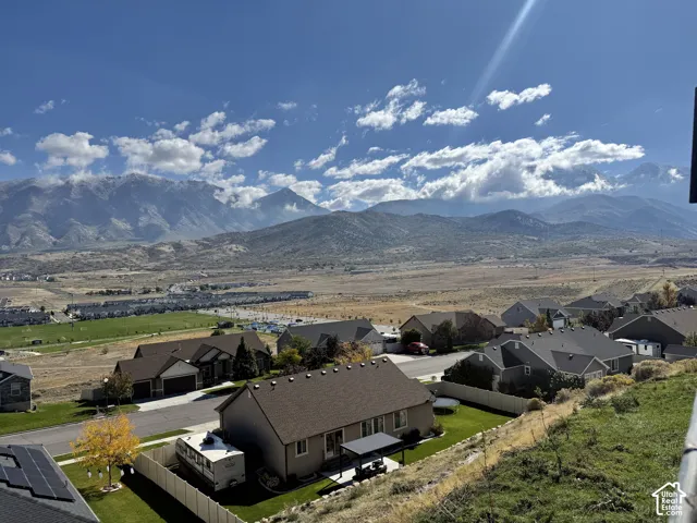 Panoramic mountain landscape featuring vast desert terrain and residential surroundings
