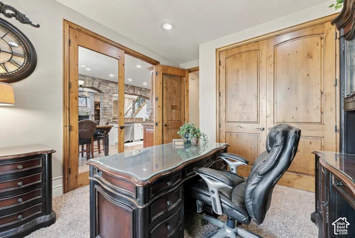 Natural wood-finish French doors, recessed lighting, and dual wood-finish closet doors. Currently an office but could be repurposed to a butler's pantry, or extend the dining room or walled off to be a more private bedroom with a bathroom being right next