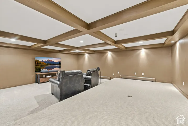 Coffered ceiling with integrated recessed lighting, tiered flooring, and brand new wall-to-wall carpeting. Wired for projector and speakers.