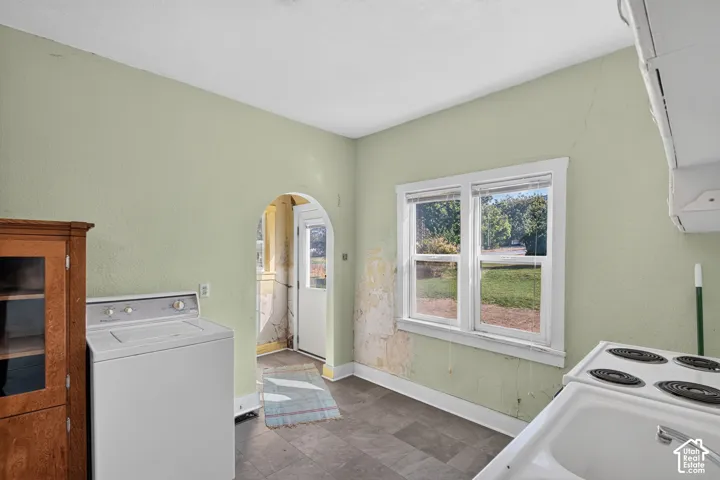 Arched entryway, double-pane windows, and tile-finish flooring