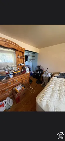 Bedroom featuring a recessed closet with built-in shelving