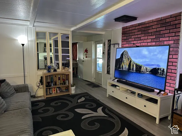 Hard flooring in the living room and kitchen areas.