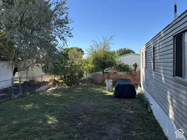 Big backyard. Picket fenced off.