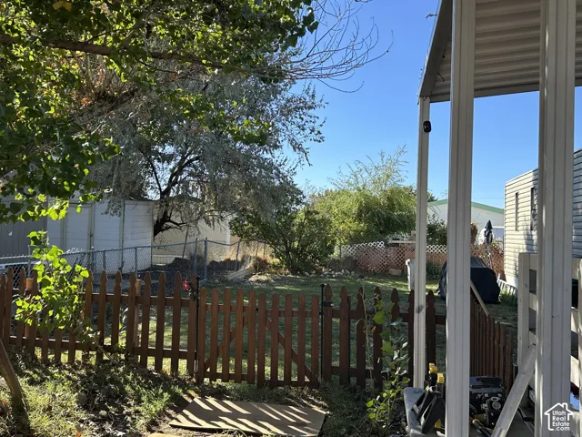 Picket fence surrounds the backyard.