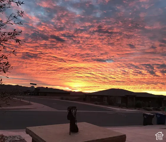 Prominent mountain backdrop against a vibrant sunset sky