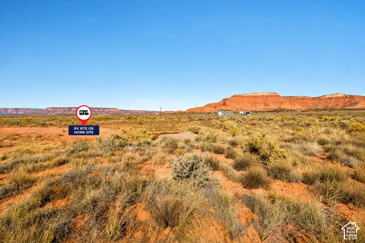 Expansive undeveloped acreage featuring desert terrain and prominent red rock mountain scenery