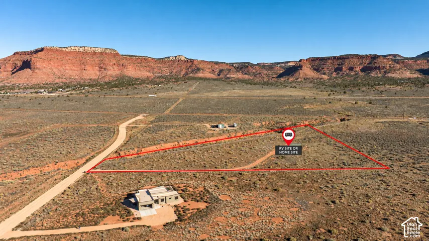Expansive acreage featuring unpaved road access and prominent mountain topography