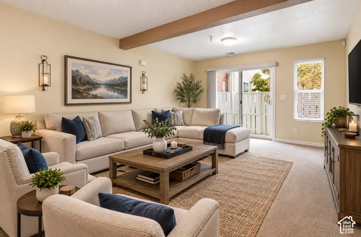 Living area featuring a structural wood-finish ceiling beam, wall-mounted lanterns, sliding glass doors, and dual-pane windows