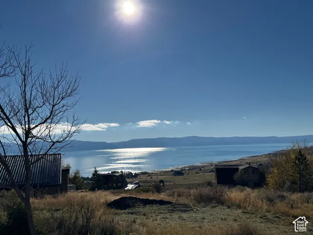Expansive landscape featuring unobstructed water frontage and panoramic mountain scenery