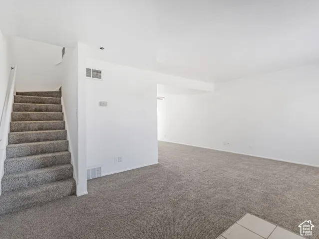 Unit A-Stairs leading to 2nd level bedrooms.