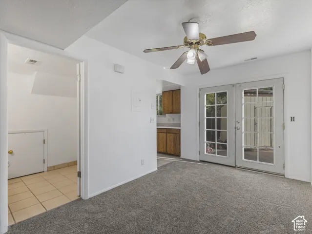 Unit A-View of back friench doors, kitchen and 1/2 bath with washer dryer hookups.