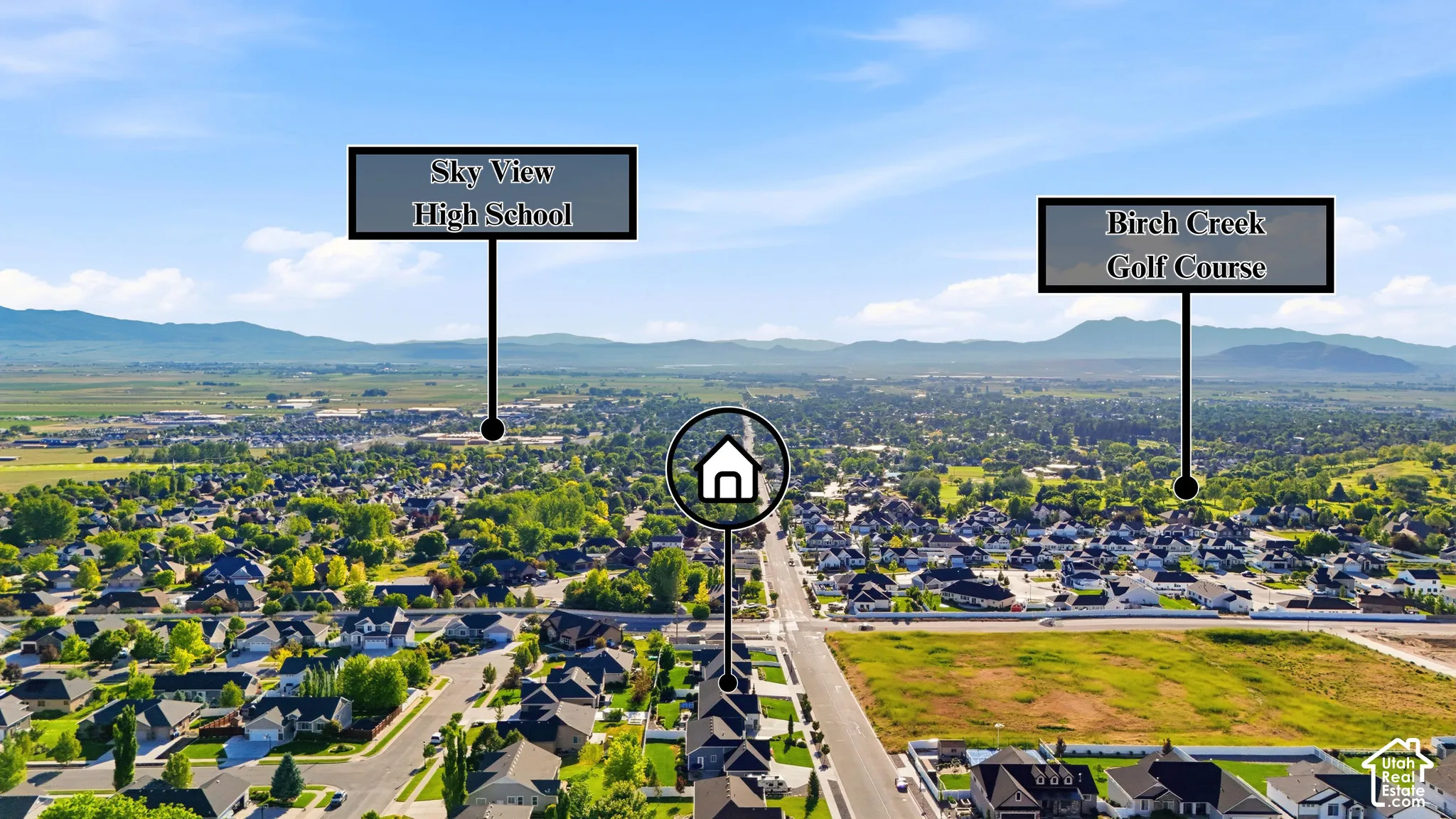 Aerial perspective of the residential property featuring mountainous surroundings and proximity to regional infrastructure and recreational golf course