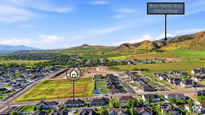 Aerial perspective featuring proximity to the Uinta-Wasatch-Cache National Forest and expansive mountain terrain